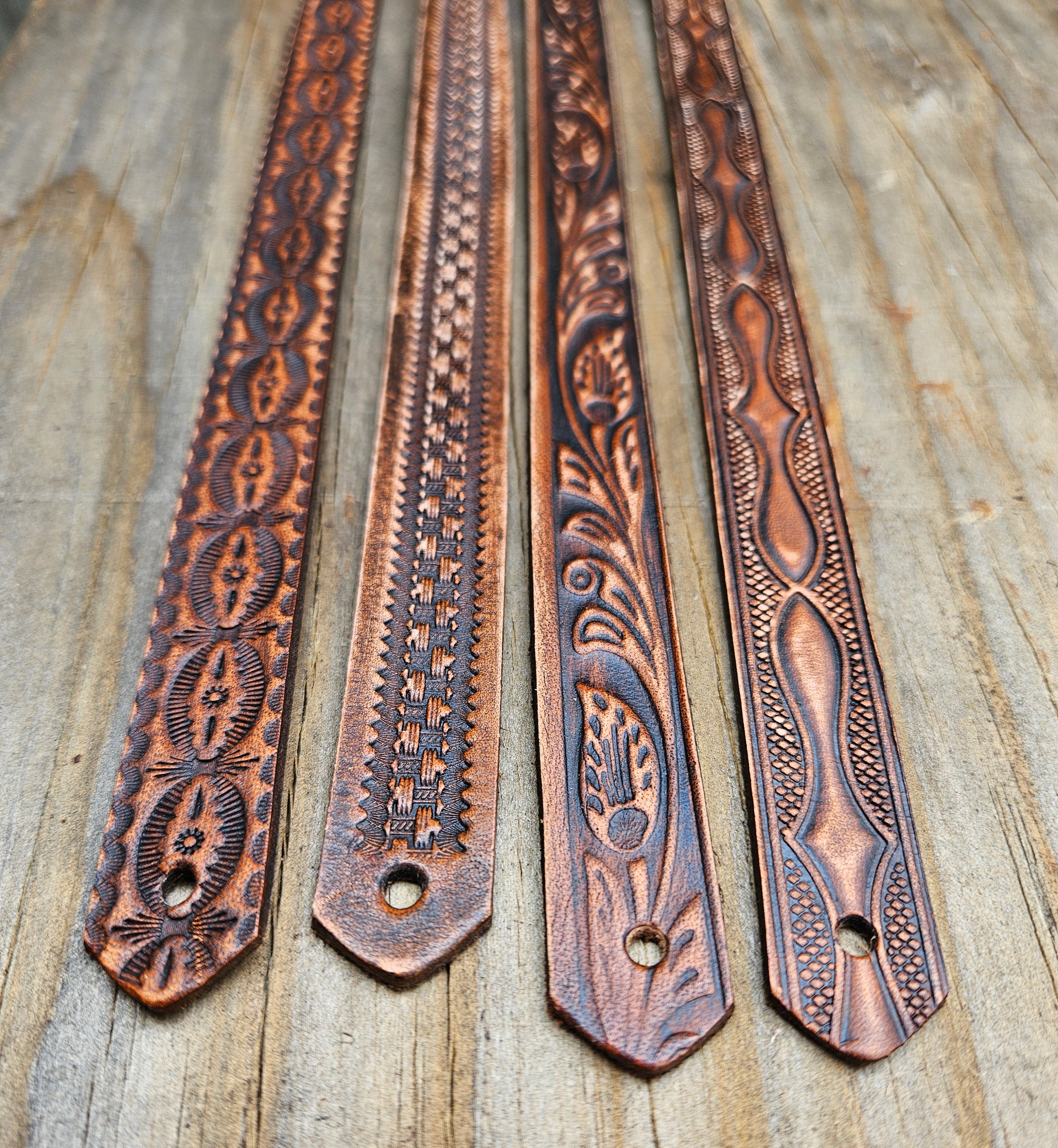 Classic Western Styled, embossed pattern leather hatbands that are 3/4" wide fitting up to size 7 1/2 hat.&nbsp; Fit's most any hat with adjustable bead and leather 1/8" string. Will fit most WESTERN crowned hats. Made in our Smyrna, TN. shop a short drive from downtown Nashville, TN.

These are random hatbands made in store and we put them in a 3 packs at a Discounted price. See the others
23" long (without tie string)
NO subs.