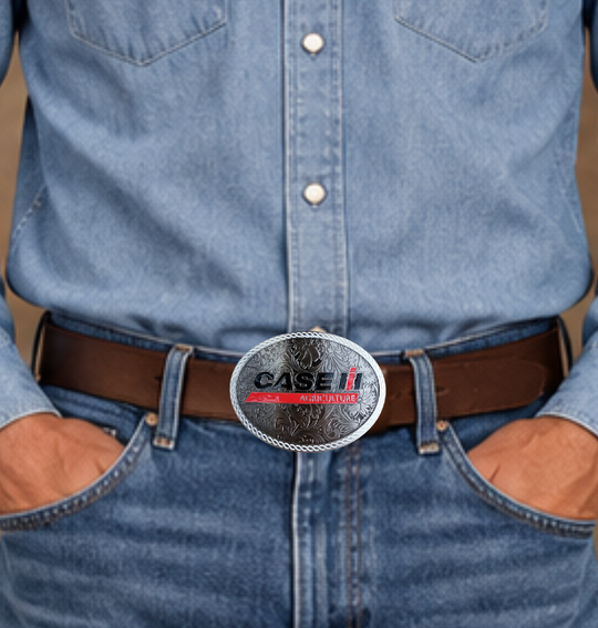 CASE Farmall IH Belt Buckle. Western Floral background oval with classic logo in Red, Black and a White rope style border. Size approx. 3 3/4" wide x 2 3/4" height, Fits up to 1 1/2" wide belts. Available in our shop in Smyrna, TN just outside Nashville.