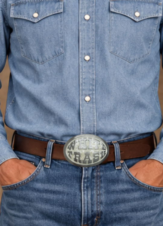 This White Trash Belt Buckle features a stylish oval design on a pearlized epoxy background. Made in the USA, it can easily be attached to any belt and fits 1 1/2" belts. Find it at our Smyrna, TN shop, just a short drive from Downtown Nashville. The size is approximately 3-1/2" x 2-3/4".