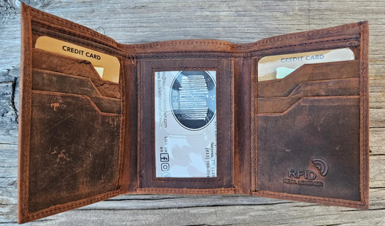 The Winston Tri-fold leather wallet will be your daily carry. Equipped with 8 credit card slots and 1 ID window slot in the center. The main compartments has a cash divider. Lined with RFID blocking. Available in our Smyrna, TN shop near Sewarts Landing.

Made in India.
Approx. Size: 3 1/4"x 4 1/4" when closed.