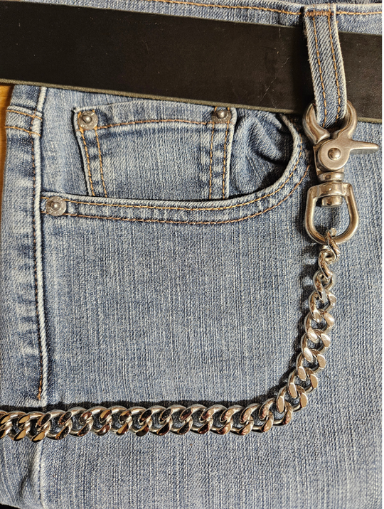 Your wallet chain says something about who you are. This one Stainless Steel Chain is Simple but Sturdy and will keep your wallet where it needs to be. The sturdy scissor clip attaches to your jeans and the split ring attaches to your wallet. Stainless Steel will not chip or peel like like normal chains and will hold up for many years. Ride down and get yours in our shop just outside Nashville in Smyrna, TN.  26" Total Length 26" Total Length
Weight 7.5 oz