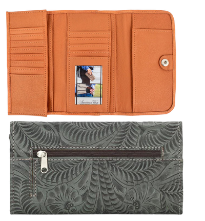 Full grain leather tri-fold wallet hand-stained, boasting a wild western floral hand-tooled pattern. Snappily close it with the spring snap and store your coins in the back zippered pocket. Inside the wallet, you'll find 12 credit card slots, an ID spot, multiple currency stations, and a checkbook flap! Plus, with the cotton linen dividing the pockets, it stays lightweight. Collect yours from our Smyrna, TN spot near Nashville!