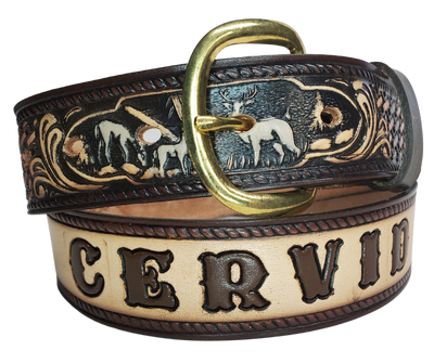 The Stag, Doe, Fawn leather belt is a classic Outdoors Pattern with DEER Family or the "Cervid".   Perfect the Outdoors lover in your family. Available in a 1 1/2" width. Full grain vegetable tanned cowhide, Width 1 1/2" and includes Nickle plated  buckle Smooth burnished painted edges. Made in USA! For name Type name desired on belt in "Type Name Here" section, no more than 9 LETTERS maximum on this PARTICULAR belt. Buckle snaps in place for easy changing if desired. In stock at our Smyrna, TN shop.