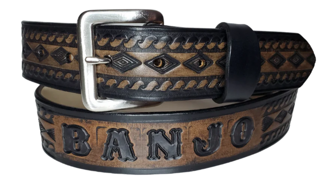 "The Banjo" is a handmade real leather belt made from a single strip of cowhide shoulder leather that is 8-10 oz. or approx. 1/8" thick. It has hand burnished (smoothed) edges and a Diamond center with a rope edge pattern. This belt is completely HAND dyed with a multi step finishing technic. The antique nickel plated solid brass buckle is snapped in place with heavy snaps.  This belt is made just outside Nashville in Smyrna, TN.