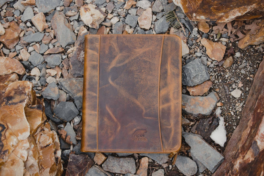 The Nomad Leather Portfolio is the perfect blend of rugged durability and professional style, designed to keep you organized wherever work takes you. Crafted from top-grain water buffalo leather, dedicated sleeve for a tablet, documents, and a letter size pad or planner insert. Whether you’re in the office, traveling, or working remotely, the Nomad Portfolio ensures you stay prepared in timeless leather craftsmanship. See them at our Smyrna, TN shop.