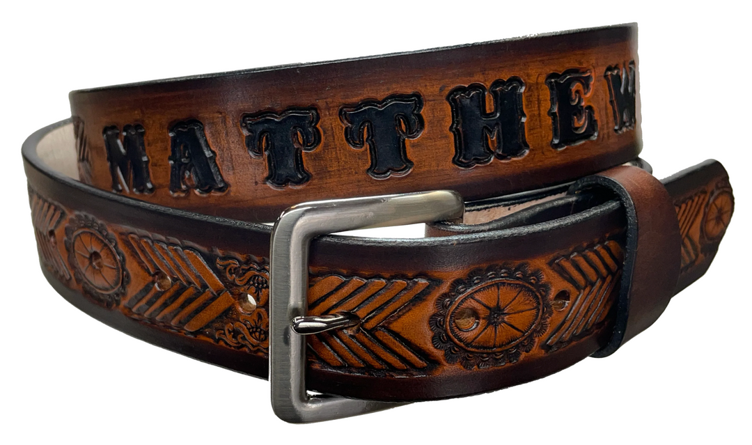 This unique belt features a chevron shape that replicates a hand-laced look, plus an oval concho. Snap-on buckle made from veg tan cowhide in your choice of finish or with a name. Crafted with care in Tennessee, just a hop, skip, and a jump away from Nashville.