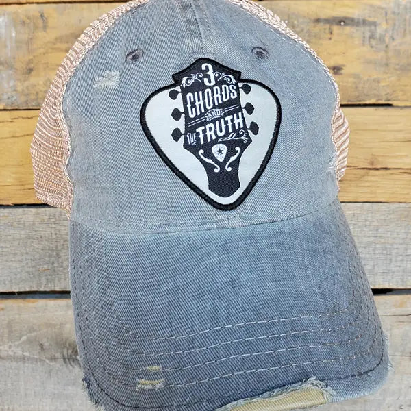 The 3 Chords and Truth has guitar headstock graphic in a pick shaped patch. It's Super soft with rips and tears for that well worn look. Faded blue twill front, cream color mesh back with snap back for adjustment. Available online and in our retail shop in Smyrna, TN.