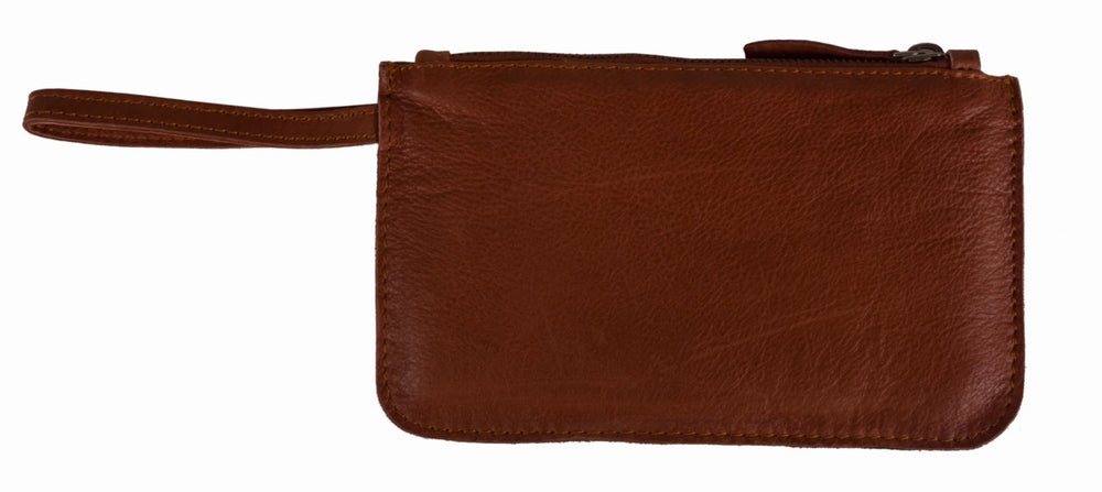 Our Kara wallet is a minimalist, sleek wristlet made from super soft Nappa leather. It can keep all your credit cards, cash, phone, and knick-knacks safely. Also works as a wristlet or keep it in your favorite bag when you have more stuff. Get yours at our world famous Smyrna, TN leather shop a short Uber ride from downtown Nashville.