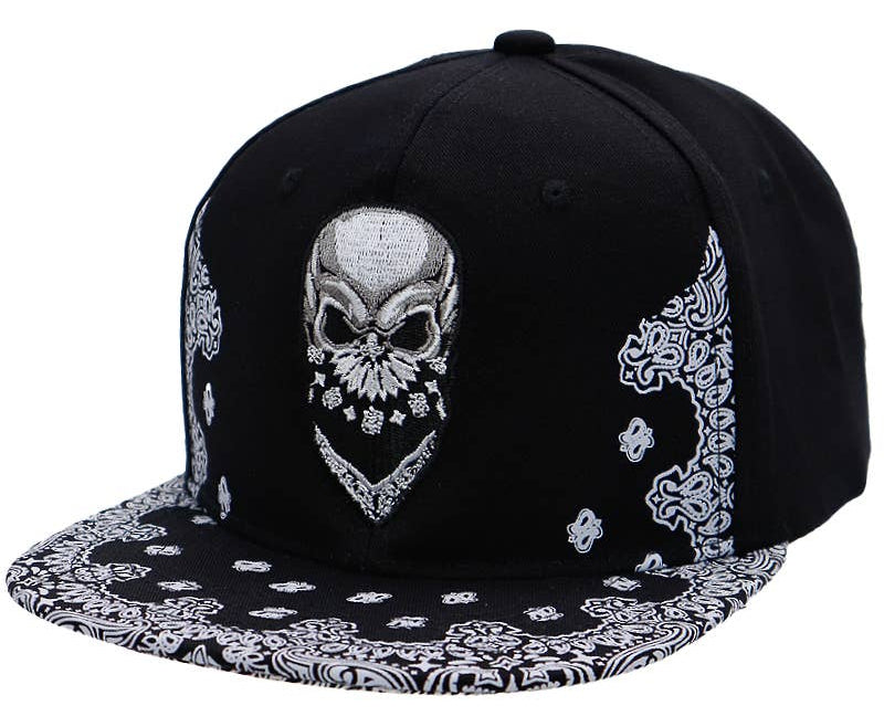 Skull Embroidered Paisley Bandana Print Six Panel Flat Bill Cotton Snapback. A skull is framed by a Timeless bandana design on the bill. In Stock at our Smyrna, TN shop not far from Murfreesboro.

100% Cotton
Snapback adjustment