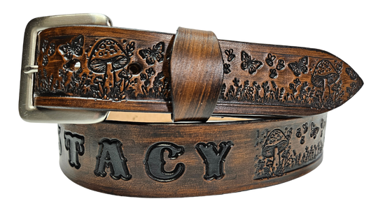 Our 1 1/2" Throwback Groovy Mushroom is a solid strip of USA veg-tan cowhide, embossed with a scene of Mushrooms, Flowers, and Butterflies down length of belt. It is hand finished in&nbsp;3 finishes, with smooth beveled, and painted edges, approx. 1/8" thick. Sizes available are&nbsp;34" to 44" from buckle end to hole most worn. Buckle is an Antique Silver finish brass, held in place with 2 snaps for easy buckle change. Crafted by hand at our Smyrna, Tennessee shop, close to Nashville.