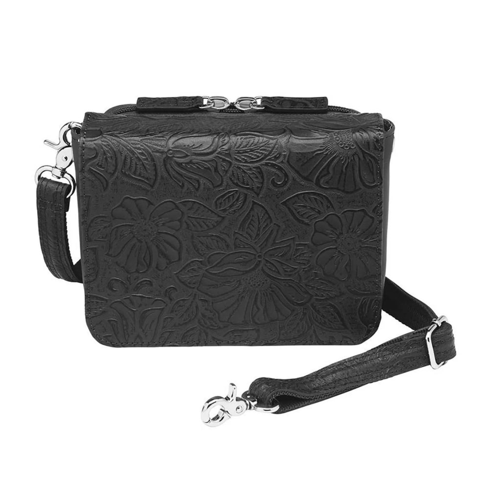 This Compact Crossbody Organizer from Gun Toten' Mama is a low profile Conceal Carry purse with enough space for just the essentials.
Get yours at our Smyrna, TN store not far from Nashville.


Tooled cowhide shows a rose leaf pattern offered in Black, Tan, or Red.
The distressed brown shows a smooth Buffalo leather.
Flap closes with a Rare Earth Magnetic Closure.
Slot and zippered lining pockets.
Pen slot.
Adjustable Slash Resistant Shoulder Strap that easily clips on and off.

Strap length 25" to 49