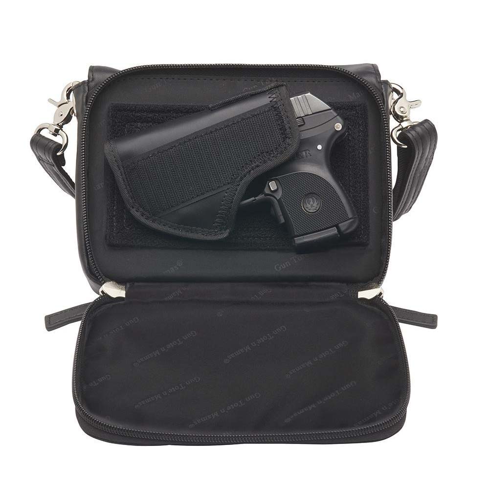 This Compact Crossbody Organizer from Gun Toten' Mama is a low profile Conceal Carry purse.
Adjustable Slash Resistant Shoulder Strap that easily clips on and off.
Strap length 25" to 49" long.
Overall Bag size: 8 - 1/4" Wide x 5 - 1/4" Tall x 2 - 1/2" Deep
GTM Gun Compartment size: 7 - 1/4" Wide x 5" Tall
Gun Footprint: 6 - 3/4" x 4 - 1/2" Tall
Designed for Left and Right Handed use.
Zipper opens all three sides to reveal an included mini holster positioned with hook and loop.