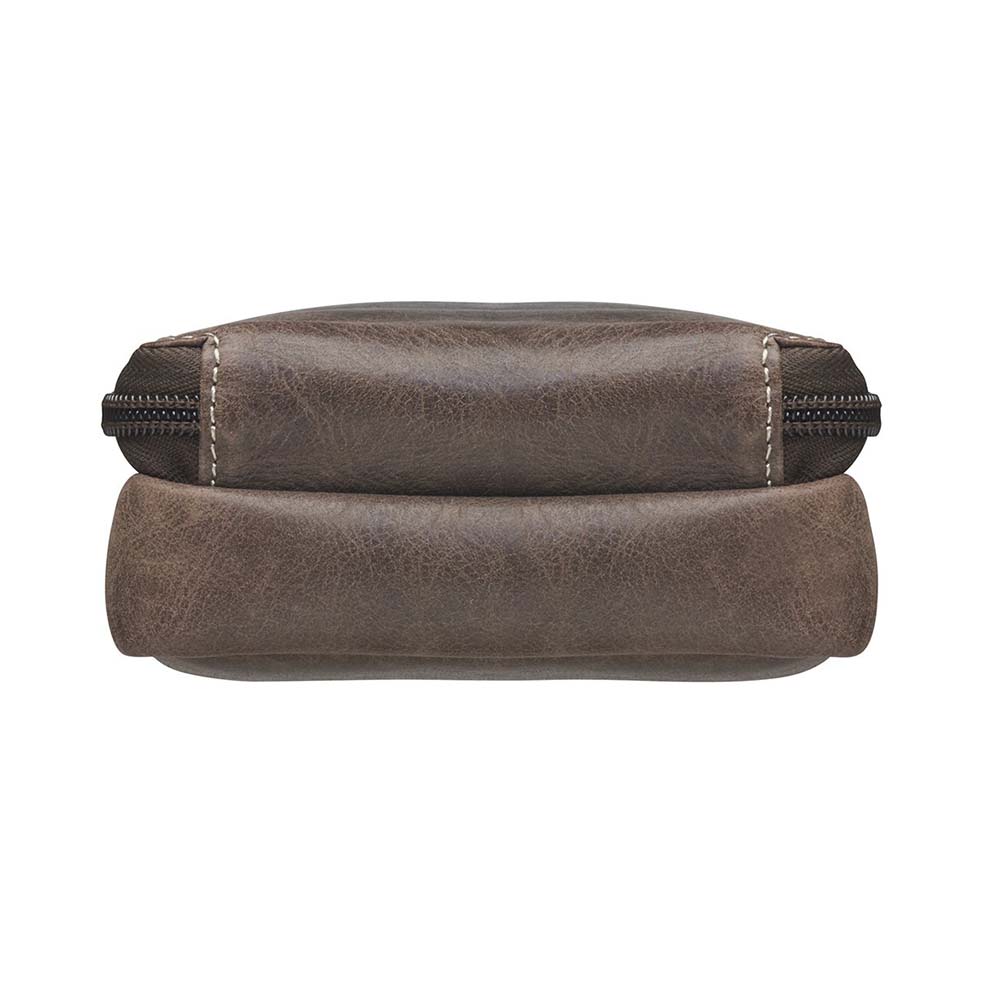 Compact Minimal Crossbody Pouch from Gun Toten' Mama is a low profile Conceal Carry purse.
Get yours at our Smyrna, TN store not far from Nashville.
The distressed brown shows a smooth oil infused Buffalo leather.
Flap closes with a magnetic closure over an open slot pocket.
Adjustable Slash Resistant Shoulder Strap clips on and off easily.
Strap length 25" to 49" long.
Overall Bag size: 5" Wide x 6-1/2" Tall x 2-1/4" Deep
Gun Compartment size: 4-3/4" Wide x 6-1/4" Tall
Gun Footprint: 4" Wide x 5" Tall