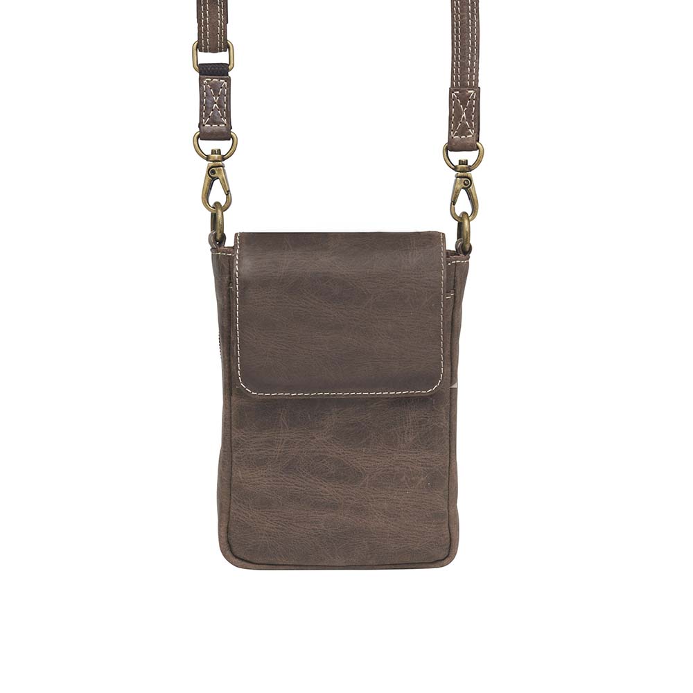 Compact Minimal Crossbody Pouch from Gun Toten' Mama is a low profile Conceal Carry purse.
Get yours at our Smyrna, TN store not far from Nashville.
The distressed brown shows a smooth oil infused Buffalo leather.
Flap closes with a magnetic closure over an open slot pocket.
Adjustable Slash Resistant Shoulder Strap clips on and off easily.
Strap length 25" to 49" long.
Overall Bag size: 5" Wide x 6-1/2" Tall x 2-1/4" Deep
Gun Compartment size: 4-3/4" Wide x 6-1/4" Tall
Gun Footprint: 4" Wide x 5" Tall