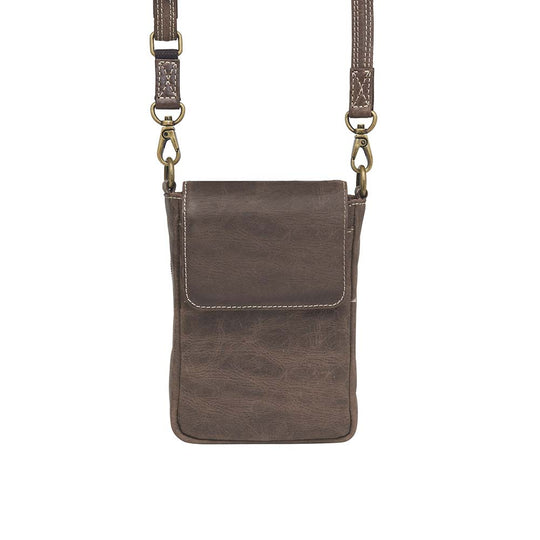 Compact Minimal Crossbody Pouch from Gun Toten' Mama is a low profile Conceal Carry purse.
Get yours at our Smyrna, TN store not far from Nashville.
The distressed brown shows a smooth oil infused Buffalo leather.
Flap closes with a magnetic closure over an open slot pocket.
Adjustable Slash Resistant Shoulder Strap clips on and off easily.
Strap length 25" to 49" long.
Overall Bag size: 5" Wide x 6-1/2" Tall x 2-1/4" Deep
Gun Compartment size: 4-3/4" Wide x 6-1/4" Tall
Gun Footprint: 4" Wide x 5" Tall