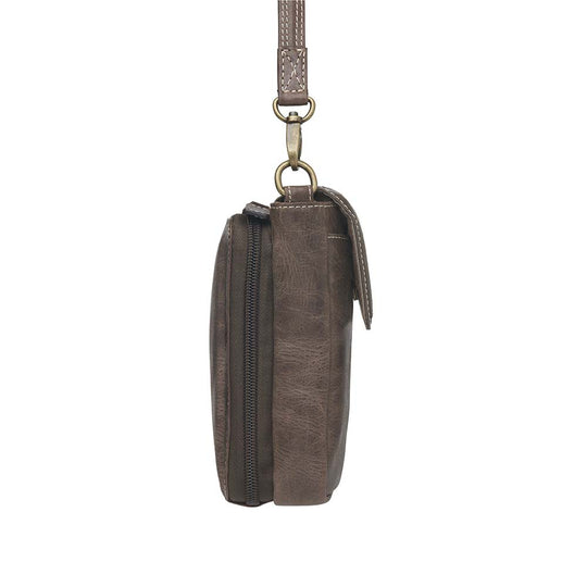 Compact Minimal Crossbody Pouch from Gun Toten' Mama is a low profile Conceal Carry purse.
Get yours at our Smyrna, TN store not far from Nashville.
The distressed brown shows a smooth oil infused Buffalo leather.
Flap closes with a magnetic closure over an open slot pocket.
Adjustable Slash Resistant Shoulder Strap clips on and off easily.
Strap length 25" to 49" long.
Overall Bag size: 5" Wide x 6-1/2" Tall x 2-1/4" Deep
Gun Compartment size: 4-3/4" Wide x 6-1/4" Tall
Gun Footprint: 4" Wide x 5" Tall