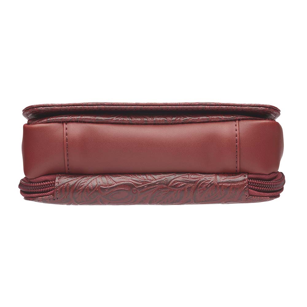 This Compact Crossbody Organizer from Gun Toten' Mama is a low profile Conceal Carry purse with enough space for just the essentials.
Get yours at our Smyrna, TN store not far from Nashville.


Tooled cowhide shows a rose leaf pattern offered in Black, Tan, or Red.
The distressed brown shows a smooth Buffalo leather.
Flap closes with a Rare Earth Magnetic Closure.
Slot and zippered lining pockets.
Pen slot.
Adjustable Slash Resistant Shoulder Strap that easily clips on and off.

Strap length 25" to 49