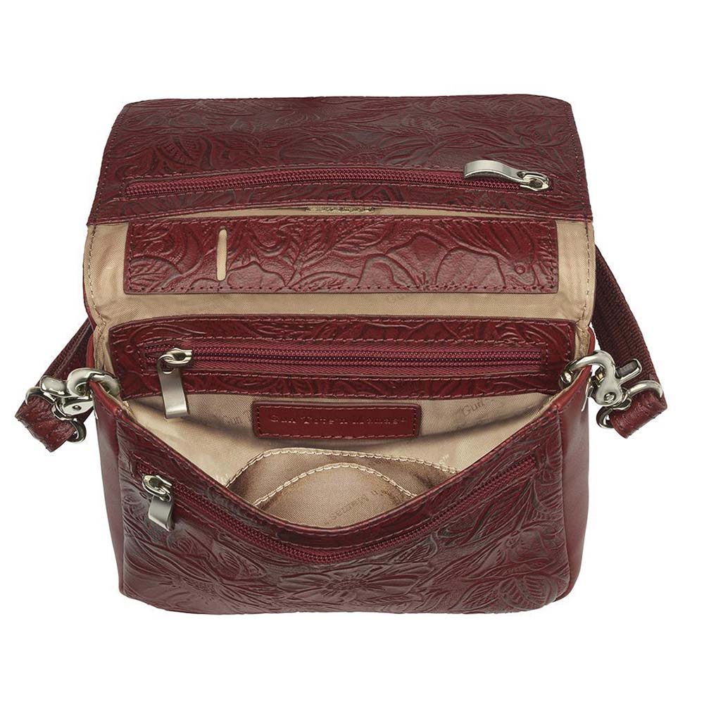 This Compact Crossbody Organizer from Gun Toten' Mama is a low profile Conceal Carry purse with enough space for just the essentials.
Get yours at our Smyrna, TN store not far from Nashville.


Tooled cowhide shows a rose leaf pattern offered in Black, Tan, or Red.
The distressed brown shows a smooth Buffalo leather.
Flap closes with a Rare Earth Magnetic Closure.
Slot and zippered lining pockets.
Pen slot.
Adjustable Slash Resistant Shoulder Strap that easily clips on and off.

Strap length 25" to 49