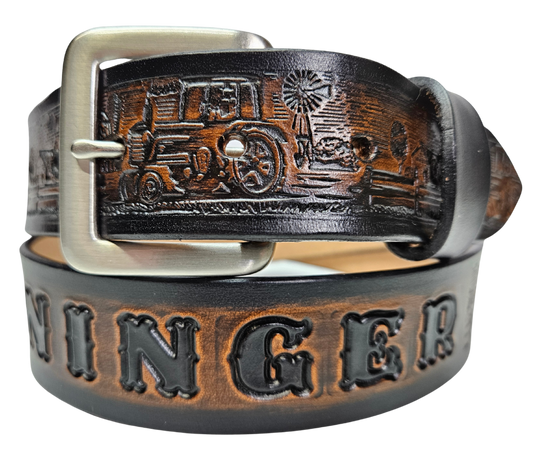 The Homestead Belt showcases the quintessential self-sustaining lifestyle through the imagery of Chickens, Tractors, Cows, and Barns. Made with 1/8" thick leather and 1 1/2" wide, the Antiqued Solid Buckle Silver is easily interchanged with two snaps. Personalize your belt with up to 10 letters. Buy yours online or come see us in Smyrna, TN, close to Nashville.