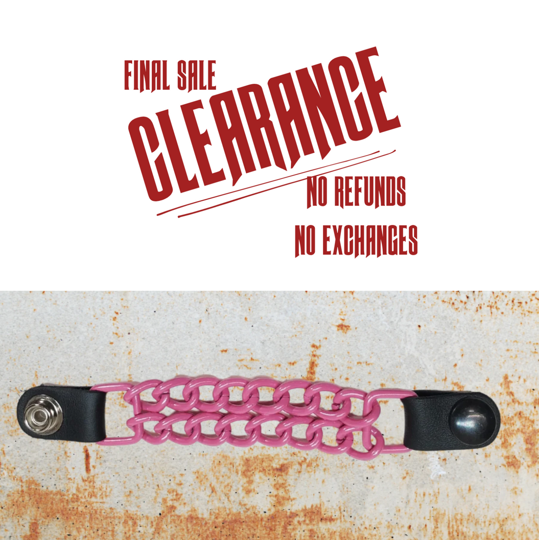 A hot pink chain-link vest chain with black leather ends and metal snap buttons.