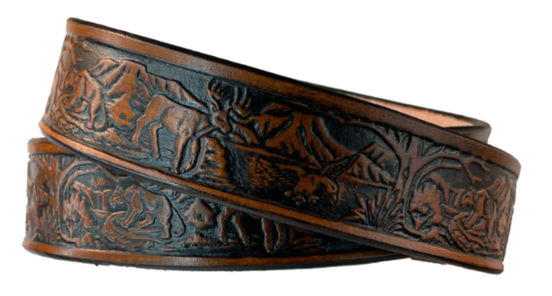 Perfect for the Outdoors type the Wilderness scene embossed on veg tanned cowhide belt, about 1/8" thick, 1 1/4" width, burnished painted edges. The buckle easily snaps into place, allowing for easy changing when desired. Handcrafted with care in our Smyrna, TN shop, our Lil&