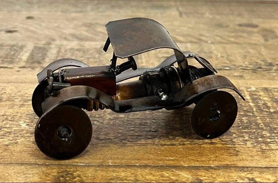 Handmade Recycled Sparkplug Art. Made with Rustic recycled metal and may have visible scratches or imperfections due to their previous use. We strive to minimize these blemishes, but they are a natural result of the recycling process. Stocked at our Smyrna, TN shop close to the Nissan plant.

2" H x 3.5" L x 1.5" W