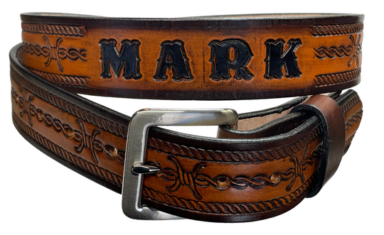 Barb Wire a western-inspired twist to any look. Made from premium veg-tan cowhide and featuring a barb wire icon design, the "Riding Fence" Name Leather Belt is the perfect way to add a touch of rustic  to your wardrobe. Hailing from our Smyrna, TN shop just outside of Nashville, TN, this belt also features an easy-to-swap buckle, so you can keep your style fresh. 