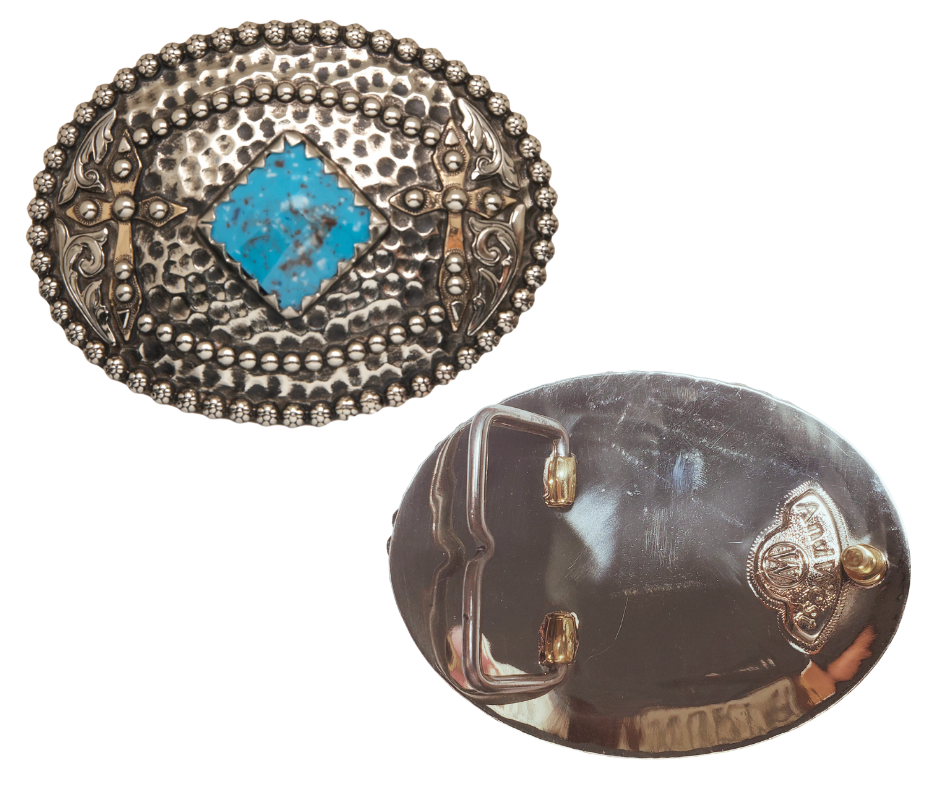 reverse side. Tubal-Cain was the original master behind crafting all your favorite bronze and iron tools. This buckle features a hammered backdrop dotted with rosettes, framed by a beaded metal edge, and sports a diamond-shaped turquoise centerpiece. Each end is decorated with a western scroll and a cross. Measuring about 3"x4", it suits belts up to 1 3/4" wide. Swing by our Smyrna, TN shop to grab yours!