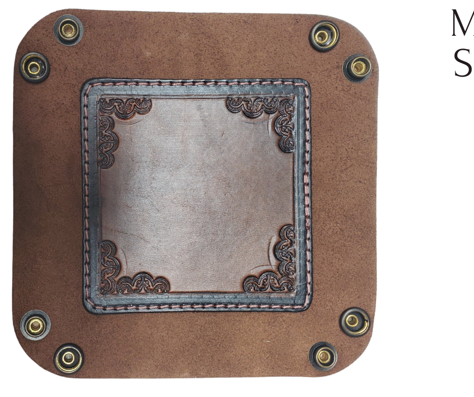 The Franklin is a little different than our other trays because of the Hand Stamped and stained inside layer. Outer layer is a Bison brown color with the inside layer being stitched in. The corners are held together with heavy line 24 Antique Brass colored snaps, for laying flat for travel, a place for placing keys, wallet, coins, etc. Made in our shop just outside Nashville in Smyrna, TN.