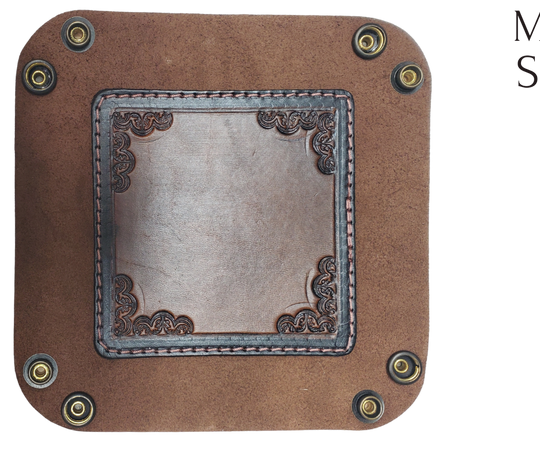The Franklin is a little different than our other trays because of the Hand Stamped and stained inside layer. Outer layer is a Bison brown color with the inside layer being stitched in. The corners are held together with heavy line 24 Antique Brass colored snaps, for laying flat for travel, a place for placing keys, wallet, coins, etc. Made in our shop just outside Nashville in Smyrna, TN.