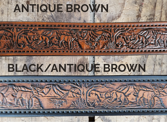 Wilderness leather belt in antique brown, coiled on a rustic wood background. 