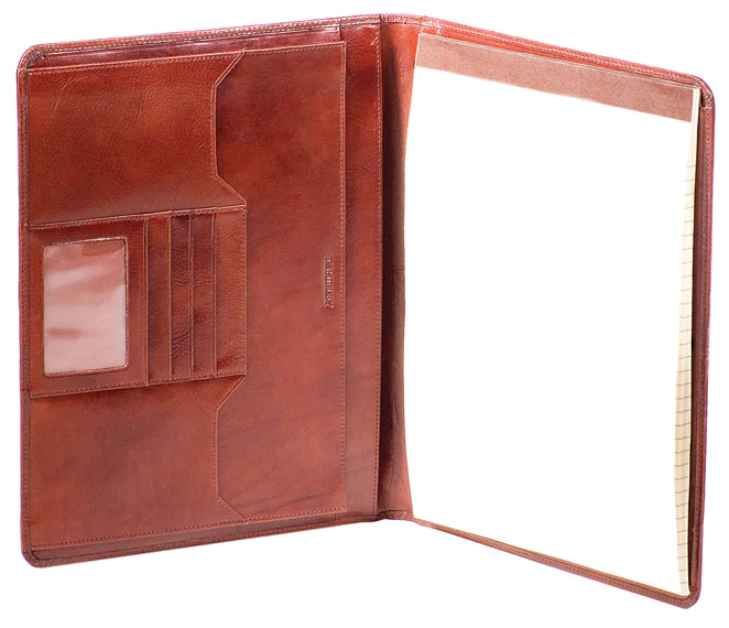 Hand stained Italian vegetable-tanned leather. Achieves old-world charm with a glossy finish & sturdy feel. Two slip pockets, four card slots, ID window & center pen sleeve. Slip pocket & gusseted pocket for documents. Writing pad is reversible for right or left hand.