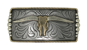 One of our more unique buckles, it has a rectangle shape with a Western scroll design, and a beaded rope edge framing a Longhorn steer. This buckle is made from German Silver (nickel and brass alloy) or iron metal base. Some buckles have motifs made of copper, iron or brass and some are adorned with synthetic stones. Buckle size is Width 5” Height 2” and is available in our Smyrna, TN shop.