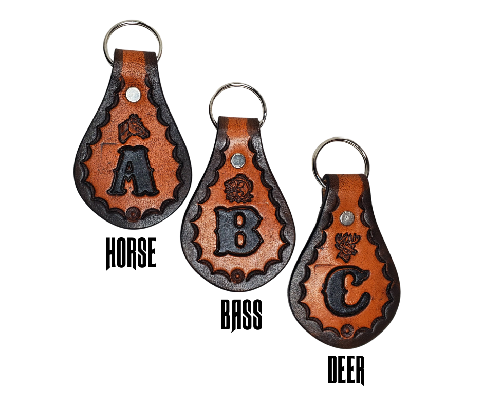 Our 1970 throwback style Leather keychain is hand stamped similar to our popular belts.  Great for identifying luggage, backpacks, or your keys! Available in the below choices All colored in our popular 2 TONE BROWN, pick one or a few, makes great gifts! Made in our Smyrna, TN shop. Please type desired initial in CUSTOM box.