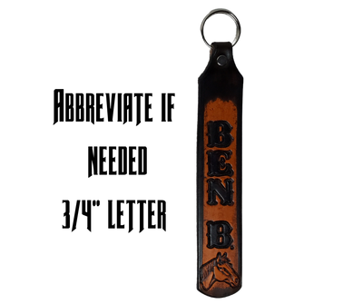 Our Customizable "1975" Longer Leather keychain embossed similar to our popular belts.  Great for identifying luggage, backpacks, or your keys! Available in the below choices All colored in our popular 2 TONE BROWN, pick one or a few. Made in our Smyrna, TN shop. Please type desired name in CUSTOM box.