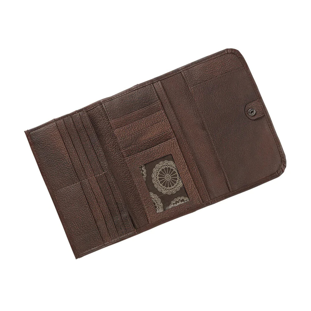 Full grain leather tri-fold wallet is 7.5” x 4”, hand-stained in a 2 tone brown, and hand-tooled in a western floral pattern. Outside includes spring snap closure and back zipper coin pocket. Interior contains 12 credit card spaces, 1 clear ID space, multiple currency pockets, and a checkbook flap. Pockets are divided with cotton linen, allowing for a lighter weight wallet. Available also in our Smyrna ,TN shop just outside Nashville. Product made in Paraguay by American West.