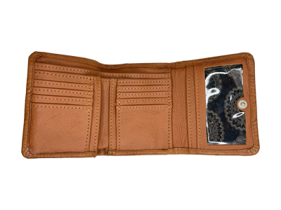 Full grain leather tri-fold wallet is 5 x 3.75". Hand-stained in a Tan, hand-tooled in western floral pattern, and accented with rosette medallion in center. Outside includes spring snap closure and back zipper coin pocket. Interior contains 8 card slots, 5 misc. card sized compartments, clear ID slot, and 2 cash compartments. Pockets are divided with cotton linen, allowing for a lighter weight wallet. Product made in Paraguay by American West.