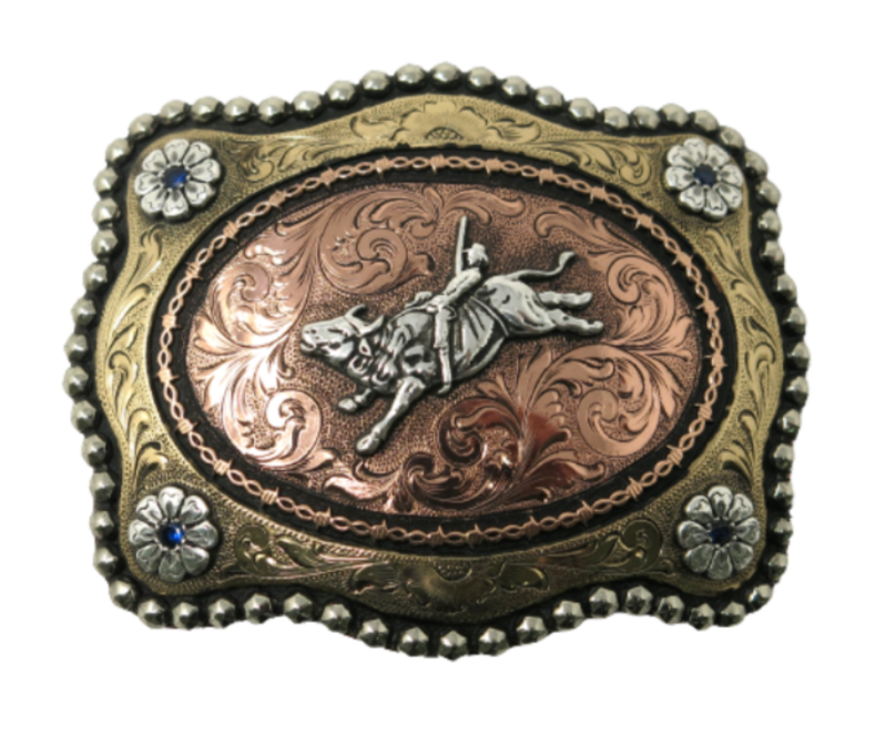 Have you ridden a Mechanical Bull? Even if you have made it 3 seconds and not 8 seconds it qualifies you to wear this Bullrider buckle. This buckle is made from German Silver (nickel and brass alloy) or iron metal base. Some buckles have motifs made of copper, iron or brass and some are adorned with synthetic stones. Our products are all handcrafted. Each piece is punched, cut, soldered, engraved, polished and painted by our talented metal workers. 