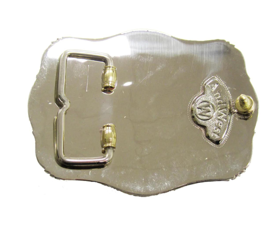 The Lonesome Steer buckle has a classic oval shape with a Western scroll design, and a beaded edge framing a Steer head. This buckle is made from 100% pure German silver (nickel and brass alloy) or iron metal base. Hand-cut layered vines and steer head in silver with copper barbwire frame design. Buckle size is 3" H x 4" W” and fits belts up 1 5/8" wide a little bigger than some of our other buckles that is available in our Smyrna, TN shop.