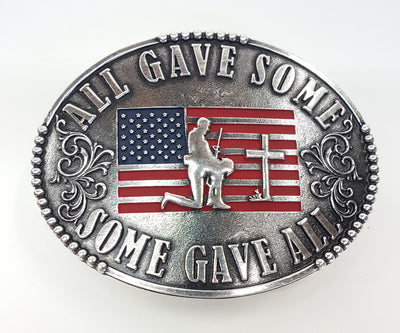 All Gave Some Some Gave All Buckle oval plate style belt buckle with American Flag inlay under kneeling soldier and cross. All Gave Some, Some Gave All imprinted around edges of buckle and scroll design on either side of wording. Available in our shop just outside Nashville in Smyrna, TN as well as on this website.  Made by AndWest in Mexico. Dimensions are 3 1/4" by 4 1/4". Another view of front of buckle.
