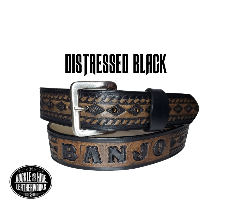 "The Banjo" is a handmade real leather belt made from a single strip of cowhide shoulder leather that is 8-10 oz. or approx. 1/8" thick. It has hand burnished (smoothed) edges and a Diamond center with a rope edge pattern. This belt is completely HAND dyed with a multi step finishing technic. The antique nickel plated solid brass buckle is snapped in place with heavy snaps.  This belt is made just outside Nashville in Smyrna, TN.