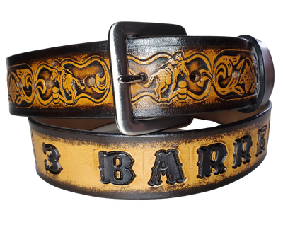 "The Barrel Racer" is a handmade real leather belt made from a single strip of cowhide shoulder leather that is 8-10 oz. or approx. 1/8" thick. It has hand burnished (smoothed) edges and a western influenced Rodeo events pattern. This belt is completely HAND dyed with a multi step finishing technic. The antique nickel plated solid brass buckle is snapped in place with heavy snaps.  This belt is made just outside Nashville in Smyrna, TN.