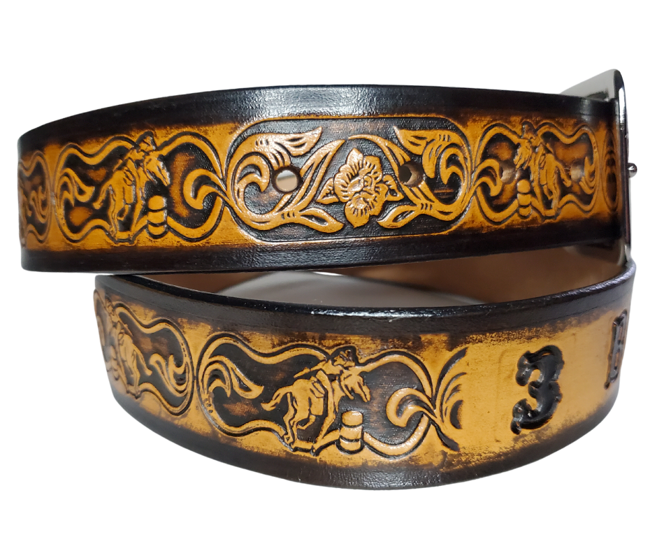 "The Barrel Racer" is a handmade real leather belt made from a single strip of cowhide shoulder leather that is 8-10 oz. or approx. 1/8" thick. It has hand burnished (smoothed) edges and a western influenced Rodeo events pattern. This belt is completely HAND dyed with a multi step finishing technic. The antique nickel plated solid brass buckle is snapped in place with heavy snaps.  This belt is made just outside Nashville in Smyrna, TN.