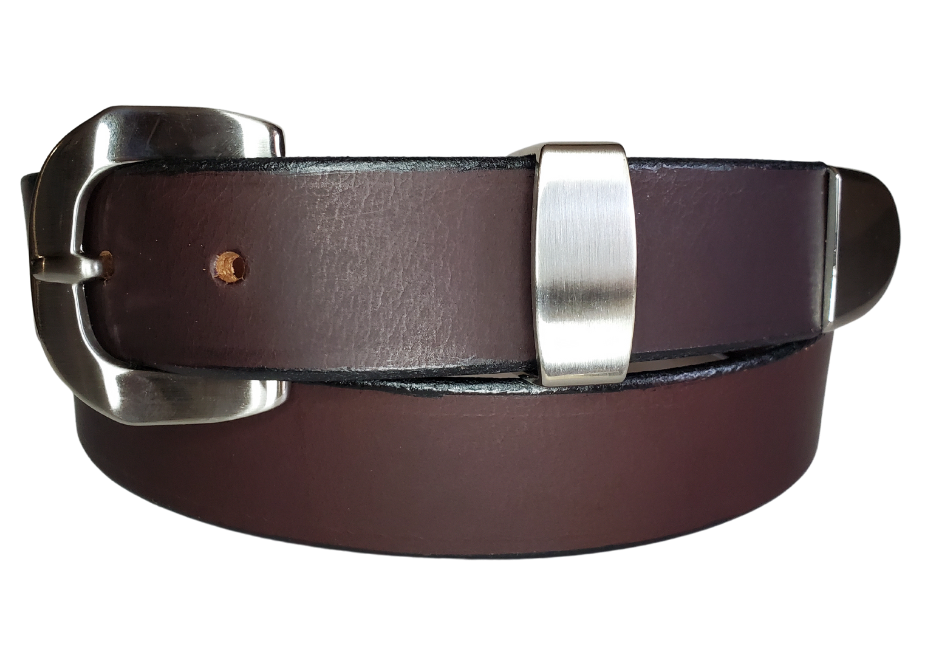 "The Arrington" handmade all leather belt is made from a single strip of Veg-Tan Water Buffalo that is 8-10 oz., or approx. 1/8" thick.  It has a 3 piece Antique Nickle plated over brass buckle with unique NO PIN for the adjustment hole that is never out of style!  The buckle is snapped in place if you ever want to change. This 1 1/4" belt is made just outside Nashville in Smyrna, TN. Perfect for casual and dress wear, it can be for personal use or for groomsman gifts or other gifts as well. 