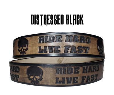 "The Daytona" is a handmade real leather belt made from a single strip of cowhide shoulder leather that is 8-10 oz. or approx. 1/8" thick. It has hand burnished (smoothed) edges and features the mantra "RIDE HARD LIVE FAST" and an HD Skull pattern down the center. This belt is completely HAND dyed with a multi step finishing technic. The antique nickel plated solid brass buckle is snapped in place with heavy snaps.  This belt is made just outside Nashville in Smyrna, TN.