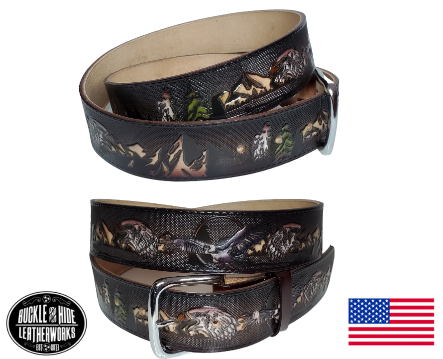 This USA made veg-tan leather belt is approx. 1/8" thick, 1 1/2"width with no fillers to split or rip apart. The belt features a scene of a Eagles framed with a outdoors pattern  around the entire belt. The leather is comfortable from day one   Buckle is snapped on for easy buckle change. Colors may vary do to the manufacturing process. We don't make this belt but it's Buckle and Hide approved and still made in the USA. There is not a NAME option on this belt