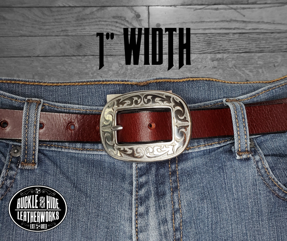 Our ladies 1" wide Deep Burgundy Red water buffalo leather belt with snaps to easily change out buckle. Features a smoothed black burnished and a oval shaped Stainless steel buckle with Western floral pattern around it's oval shape. The buckle size is 3" across x 2 1/4" tall. This belt has a softer feel than some of our Name style belts but still durable. Available online or for purchase at our shop just outside Nashville in Smyrna, TN.