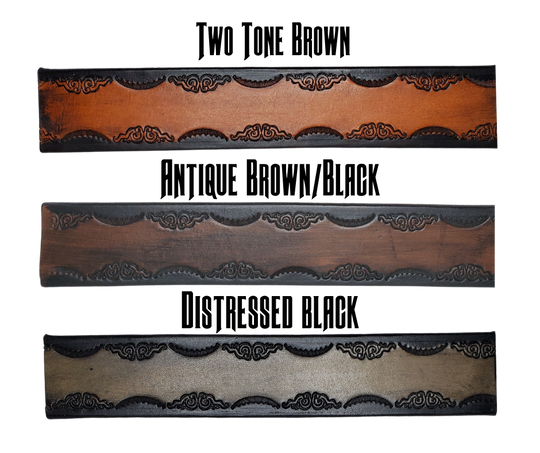 This real leather belt is handmade in our Smyrna, TN shop.  The process starts with a Veg-Tan Shoulder cowhide, which is cut into strips.  It is embossed and the edges are beveled.  The Antique Silver plated brass removable buckle is attached with snaps, you may add your own or purchase a theme buckle to personalize the look.  Please see sizing instructions to make sure you have the fit desired. 