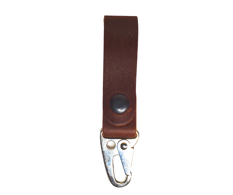 Everyone needs keys and need to know where they are! This leather belt key holder helps with just that. Go on with your day knowing your important keys are at all times. Attaches to your belt or bag or??? Made in our Smyrna, TN shop just outside Nashville, TN.