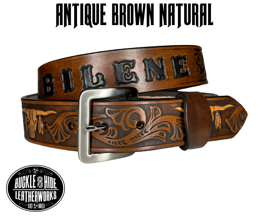 "The Longhorn"is a handmade real leather belt made from a single strip of cowhide shoulder leather that is 8-9 oz. or approx. 1/8" thick. It has smoothed edges and the Western / Longhorn scroll pattern is embossed on the surface. The antique nickel plated solid brass buckle is snapped in place.  This belt is made just outside Nashville in Smyrna, TN. 